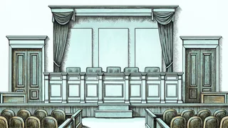 Traditional courtroom interior with judicial bench and legal professionals at work.