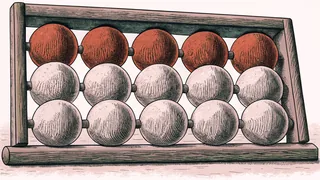 A wooden abacus strung with rows of red and white beads.