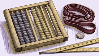 An abacus with counting beads next to a calculator and measuring ruler