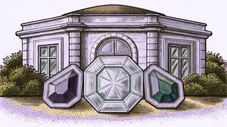 An arrangement of colorful polished gemstones on a dark surface.