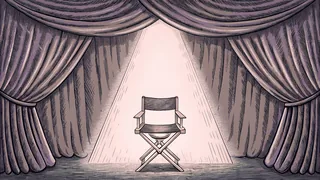 A theatrical spotlight illuminates a leather director's chair positioned in front of soft, draped velvet curtains.