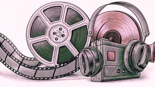 A film strip and old movie camera rest beside a vinyl record and headphones.