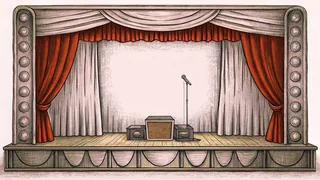 A music box, vinyl records, and vintage microphone stand decorate a theatrical dressing room vanity with mirror lights.