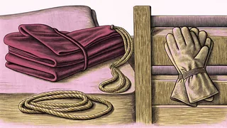 A folded uniform and training gloves sit beside a dormitory bunk bed and a coiled rescue rope.