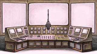 A boom microphone and control-room console sit on a desk with multiple monitors.