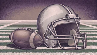 A football helmet and ball sit on a green field with white yard line markers.