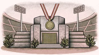 Olympic gold, silver, and bronze medals hang from ribbons on a victory podium under stadium lights.