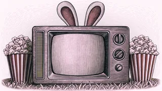 A boxy television set with rabbit-ear antennae sits beside a popcorn box.