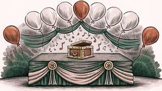 A music box with balloons and ribbons sits on a velvet-draped table.