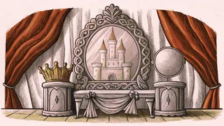 A castle crown decoration placed beside a snow globe and ribbons on an ornate display table.
