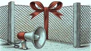A red ribbon tied to a chain-link fence next to a megaphone.