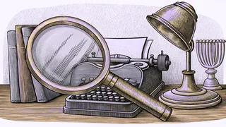 A magnifying glass rests on a desk beside a typewriter and a brass desk lamp.