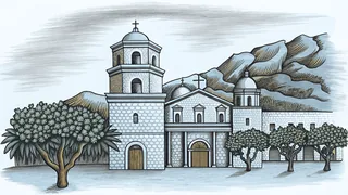 Orange trees flourish near a historic Spanish mission and grand theater in a natural canyon
