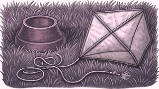 A dog bowl sitting on grass beside a kite wrapped in its own tangled string.