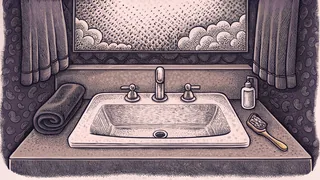 Bathroom sink with soap, towel, and toothbrush near steamy shower.