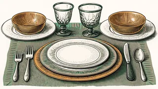 A formal table setting displays fine china and crystal elegantly.