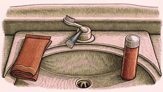 Daily dental care items arranged on a bathroom surface