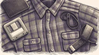 A pager and a blank floppy disk rest beside a flannel shirt and colorful slap bracelets.