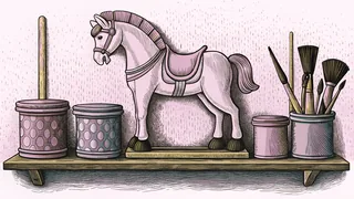Paint pots and brushes rest beside a carousel horse on a shelf.