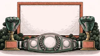A champion's boxing belt rests on a wooden stand beside a gleaming trophy and heavy gloves.