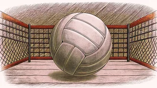 A volleyball floats above the net on a sandy court with white boundary lines.