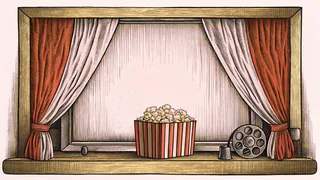 A projector and popcorn box rest on a windowsill framed by curtains.